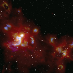 A cosmic light show sparked by the formation of massive stars in the W51 stellar nursery