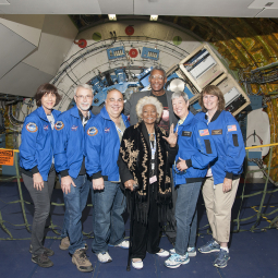 Actress Nichelle Nichols and Airborne Astronomy Ambassadors pose in front of the observatory telescope