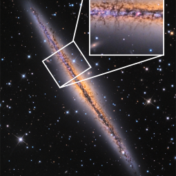 Optical image of the galaxy NGC 891 showing dark extinction features extending out from the midplane