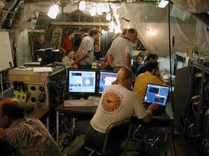 Telescope Assembly and HIPO instrument on-sky test crews at work in the SOFIA cabin