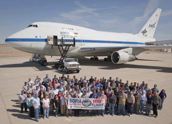 Members of SOFIA's staff gather to commemorate the 100th flight of the airborne observatory.